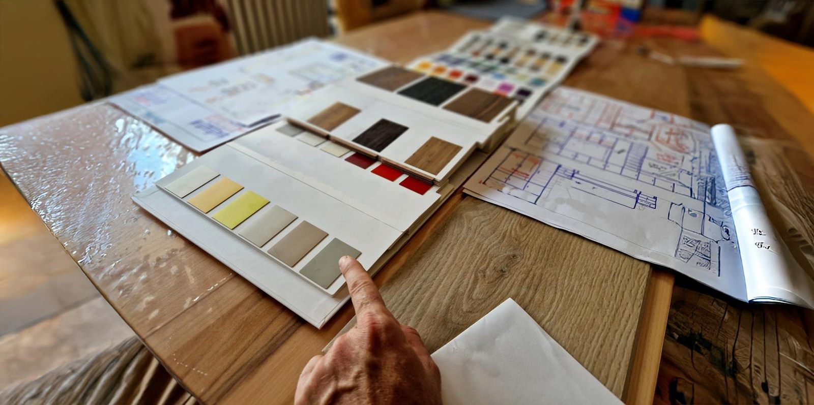 Customer comparing laminate and veneer samples against project drawings